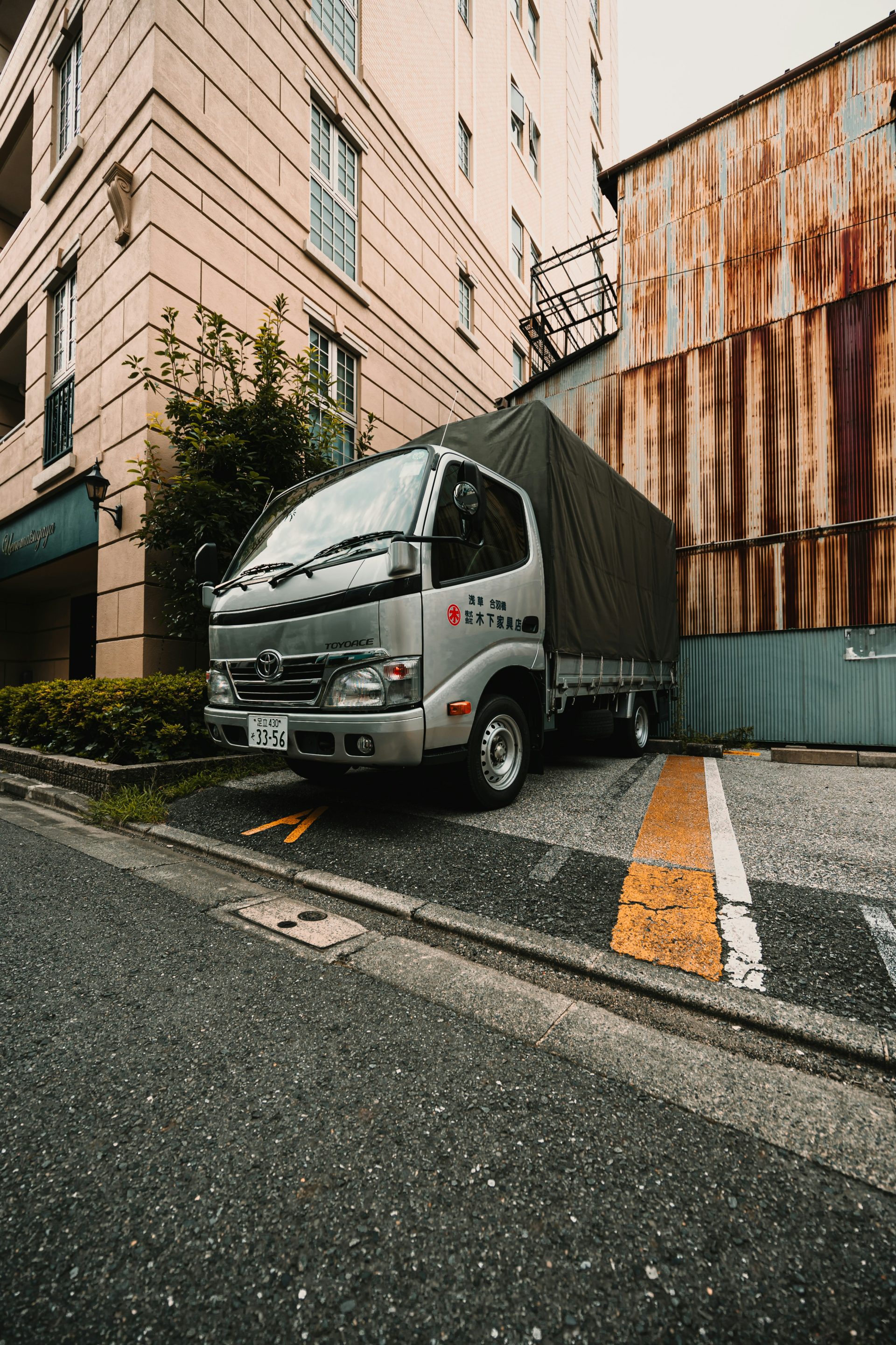 A delivery truck is parked on the street.